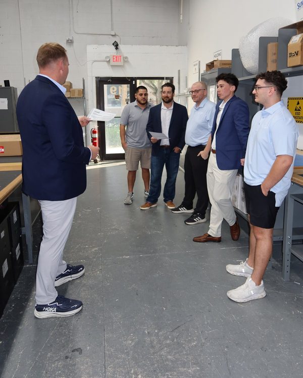 Tom Wojciechowski briefing the Skytop Aero team on the warehouse floor